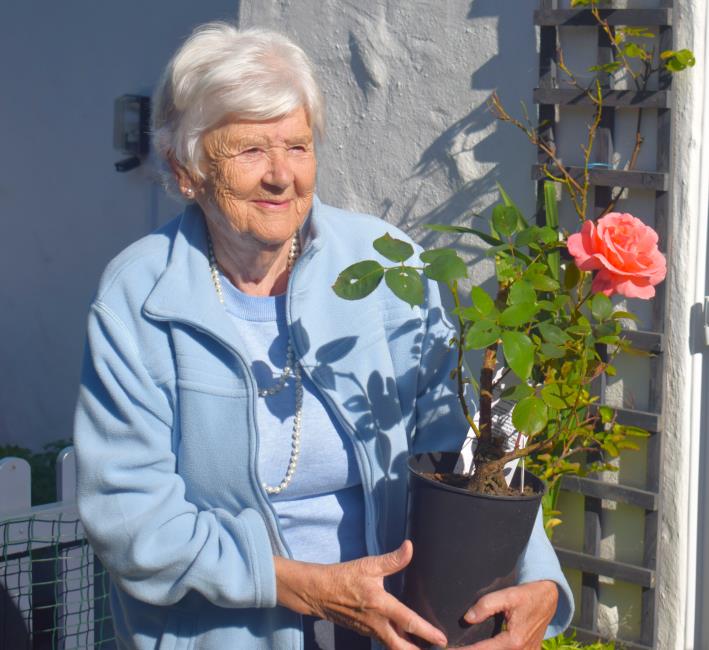 Nica with her lovely rose aptly named Leaping Salmon